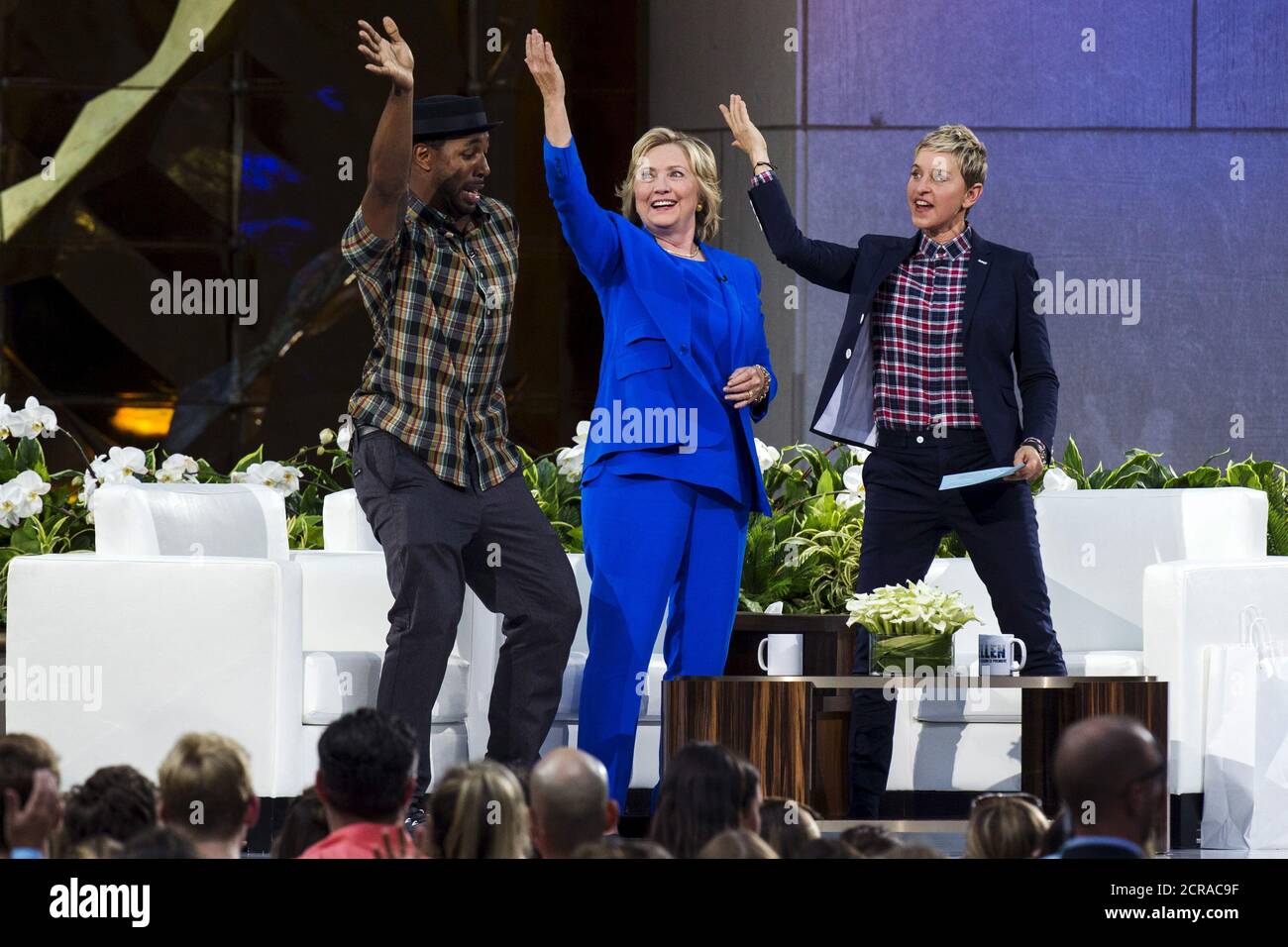U.S. Democratic presidential candidate Hillary Clinton does the "Nae Nae"  dance move with DJ Stephen "Twitch" Boss (L) and television host Ellen  DeGeneres (R) during a taping of "The Ellen DeGeneres show"