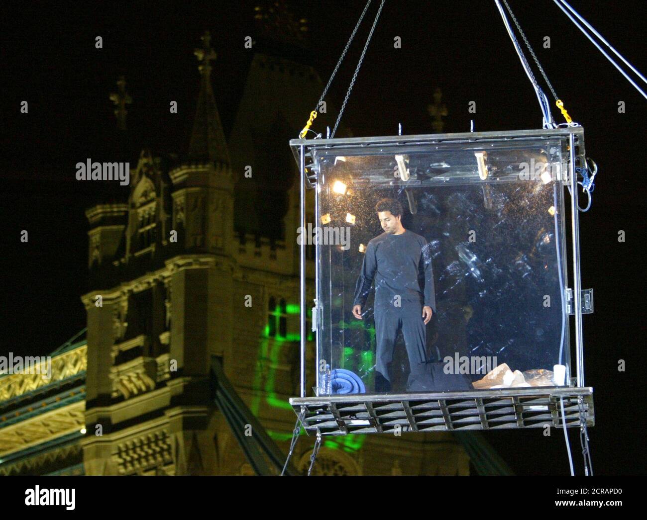 U.S. illusionist David Blaine embarks on 44 days of starvation and solitary  confinement in a glass box hung from crane by River Thames in London  September 5, 2003. Blaine will be encased