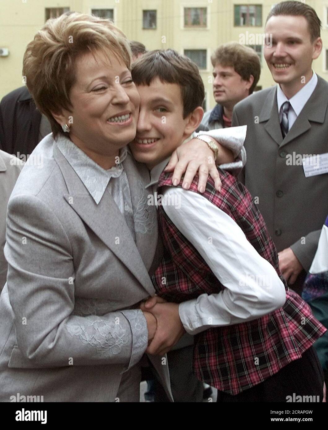 Valentina Matviyenko (L), protegee of President Vladimir Putin, hugs a young supporter after voting in St.Petersburg, October 5, 2003. Matviyenko is heavily favoured to win the gubernatorial election's runoff, but observers fear a low turnout reflecting public disaffection with the democratic process. REUTERS/Alexander Demianchuk  AD/CVI Stock Photo