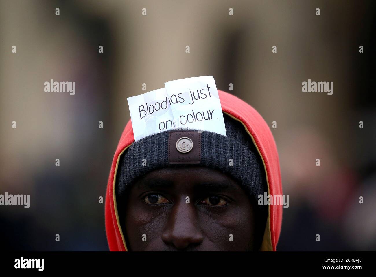 A man attends a rally against racism and in honor of Idy Diene, a Senegalese street vendor who was killed by an Italian, in Florence, Italy March 10, 2018. REUTERS/Alessandro Bianchi Stock Photo
