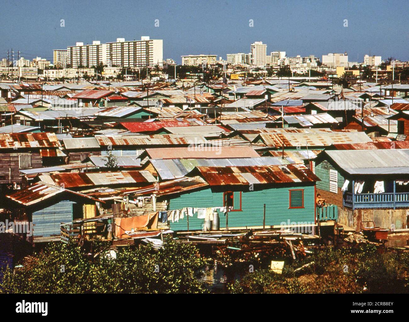 Modern Buildings Tower over the Shanties Crowded Along the Martin Pena Canal February 1973 San Juan, Puerto Rico Stock Photo