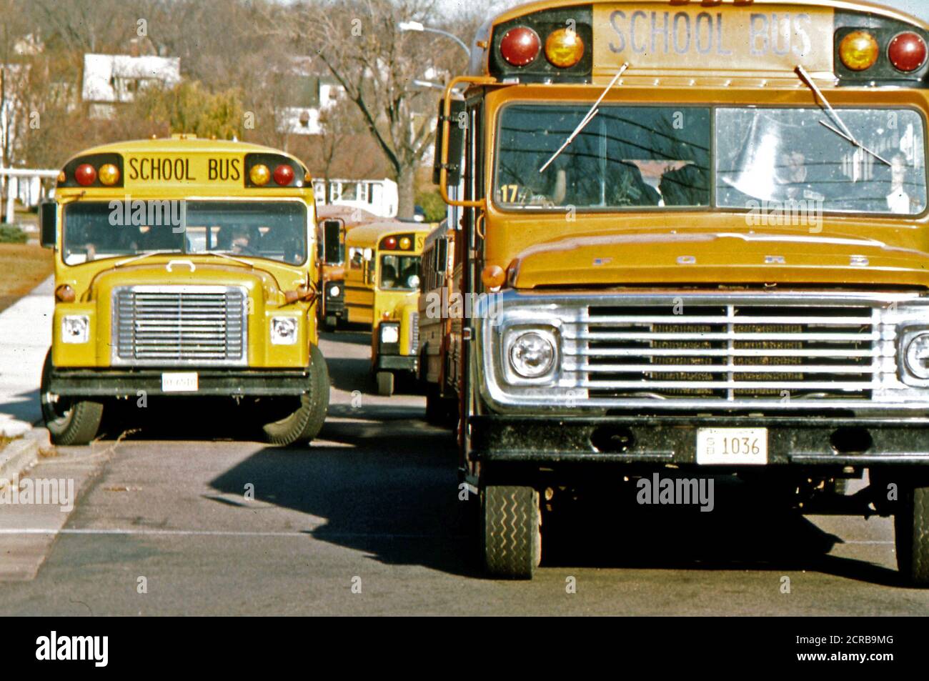 Students Arriving by School bus at Senior High School in New Ulm, Minnesota October 1974 Stock Photo