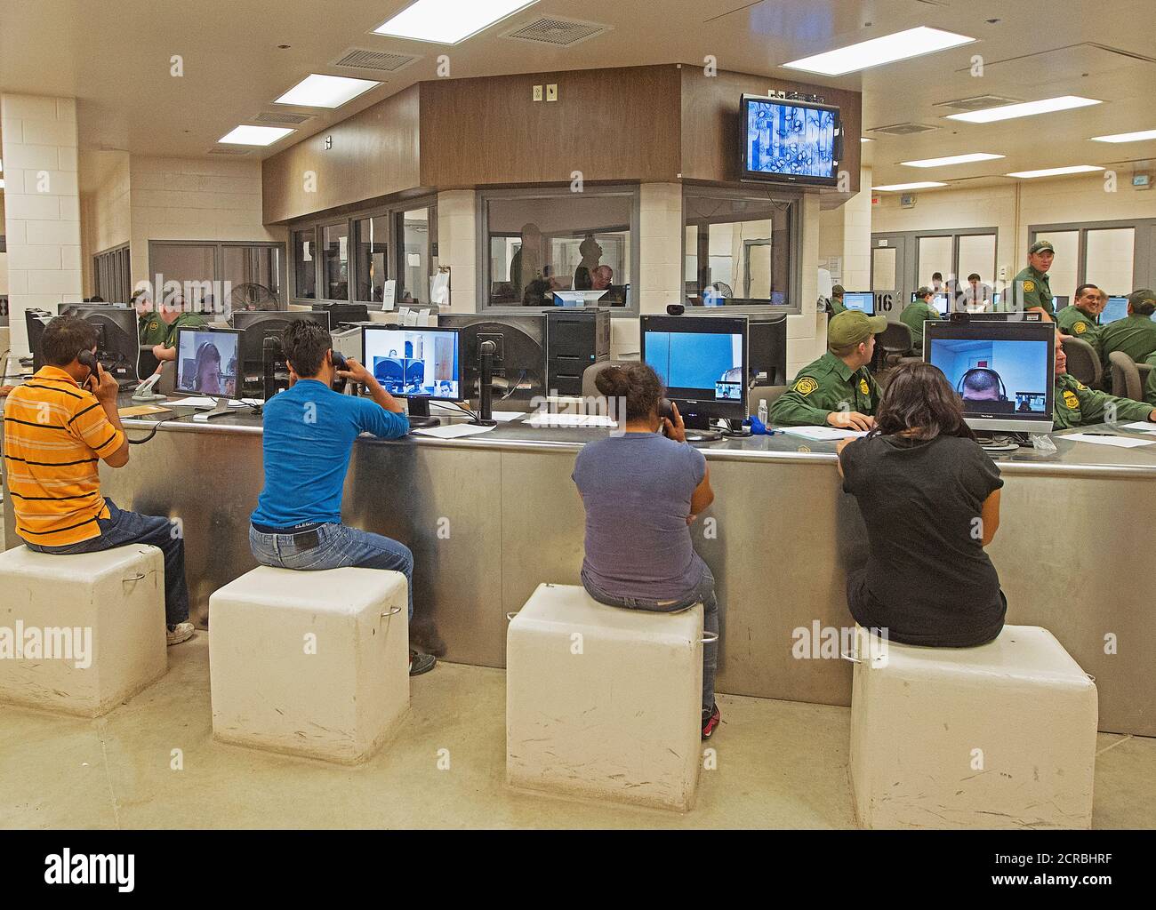 South Texas aliens who crossed the border illegally are assisted at the Customs Processing Center to determine their particular situation and solution for placement. Stock Photo