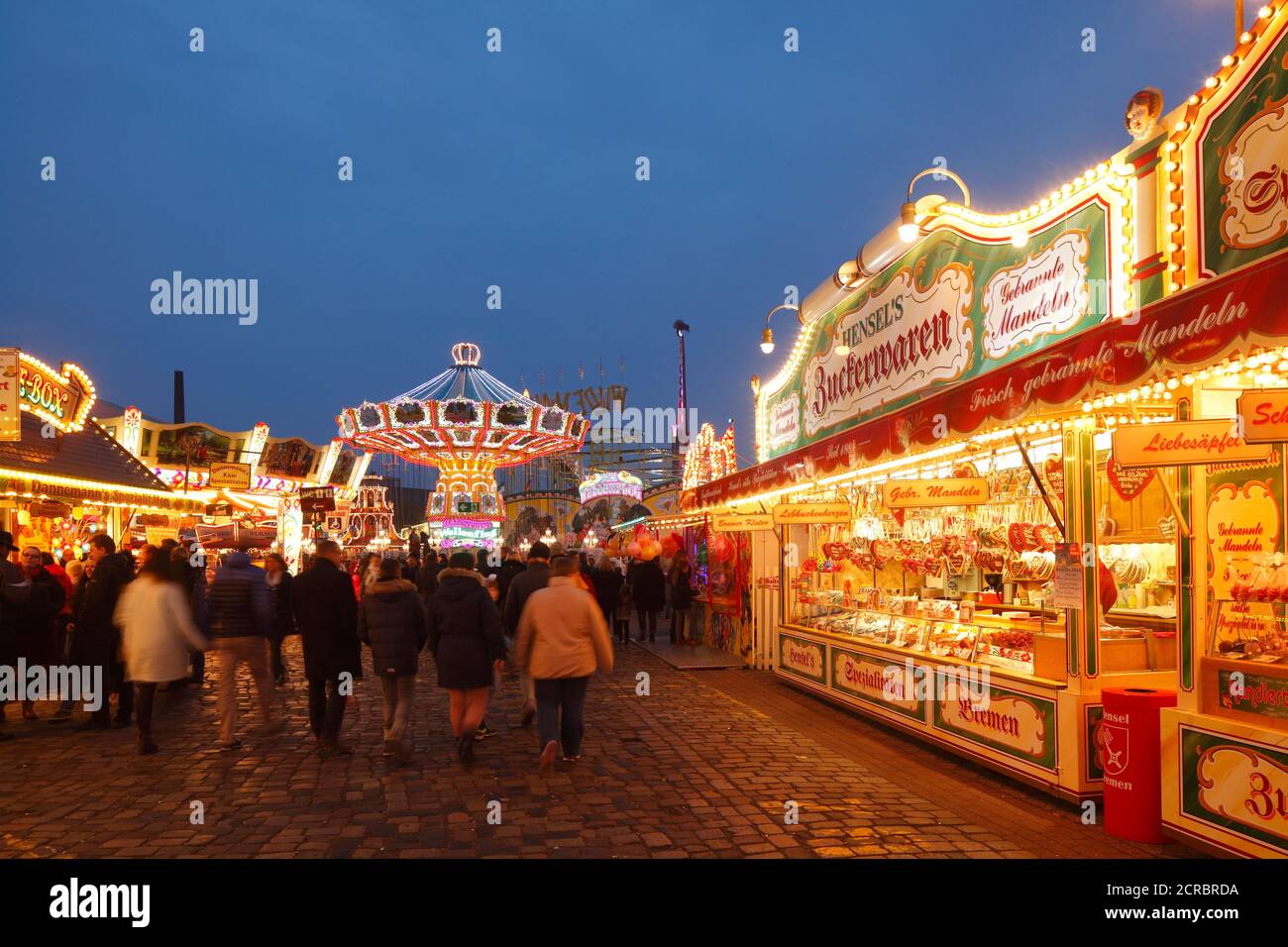 Stalls and fairground rides on the Bremer Freimarkt at dusk, Bremen, Germany, Europe Stock Photo
