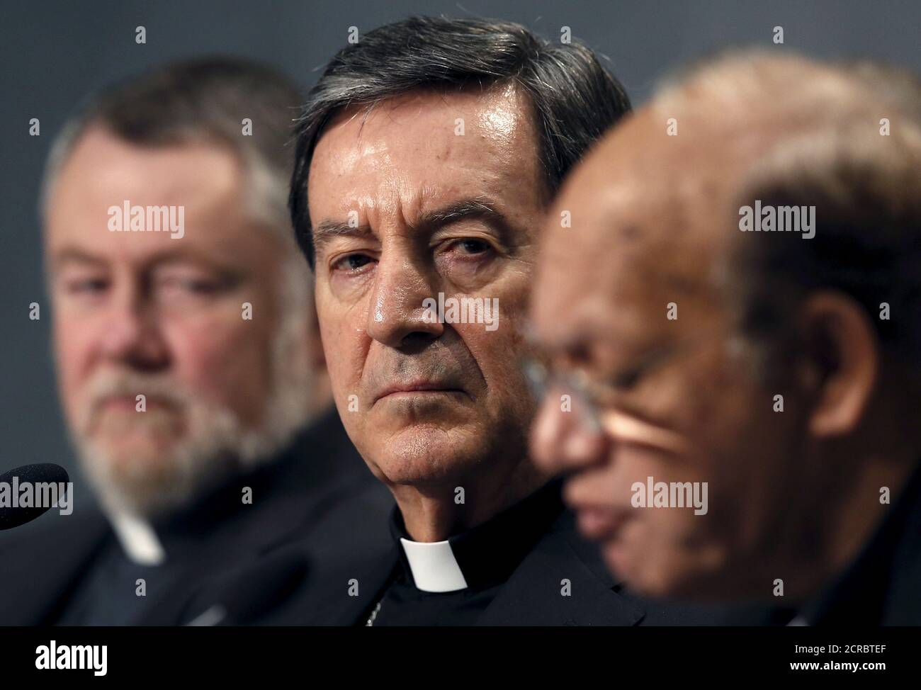 Cardinal Ruben Salazar Gomez (C) looks on as Cardinal Oswald Gracias (R) speaks during a news conference at the Vatican, October 26, 2015. Roman Catholic leaders from around the world on Monday made a joint appeal to a forthcoming United Nations conference on climate change to produce a 'fair, legally binding and truly transformational' agreement.REUTERS/Alessandro Bianchi Stock Photo