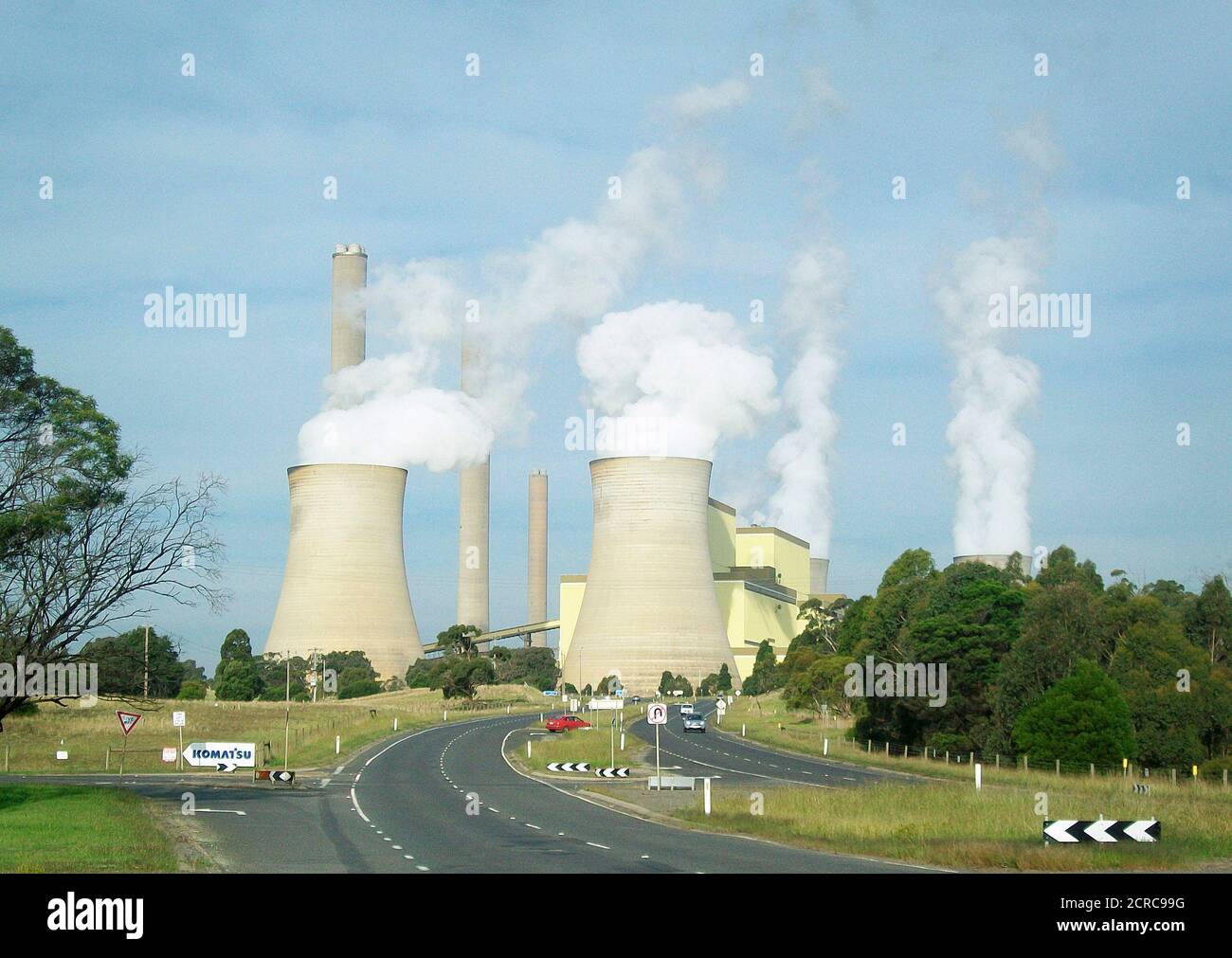 Vapour rises from cooling towers at the Loy Yang coal fired power station, about 150 km (93 miles) east of Melbourne in Victoria state April 2, 2012. After years of wrenching debate, a carbon tax on Australian industry starts in July, but instead of bringing much-needed investment certainty, the scheme is delivering the opposite. Picture taken April 2, 2012.  REUTERS/Sonali Paul (AUSTRALIA - Tags: ENVIRONMENT ENERGY POLITICS BUSINESS) Stock Photo