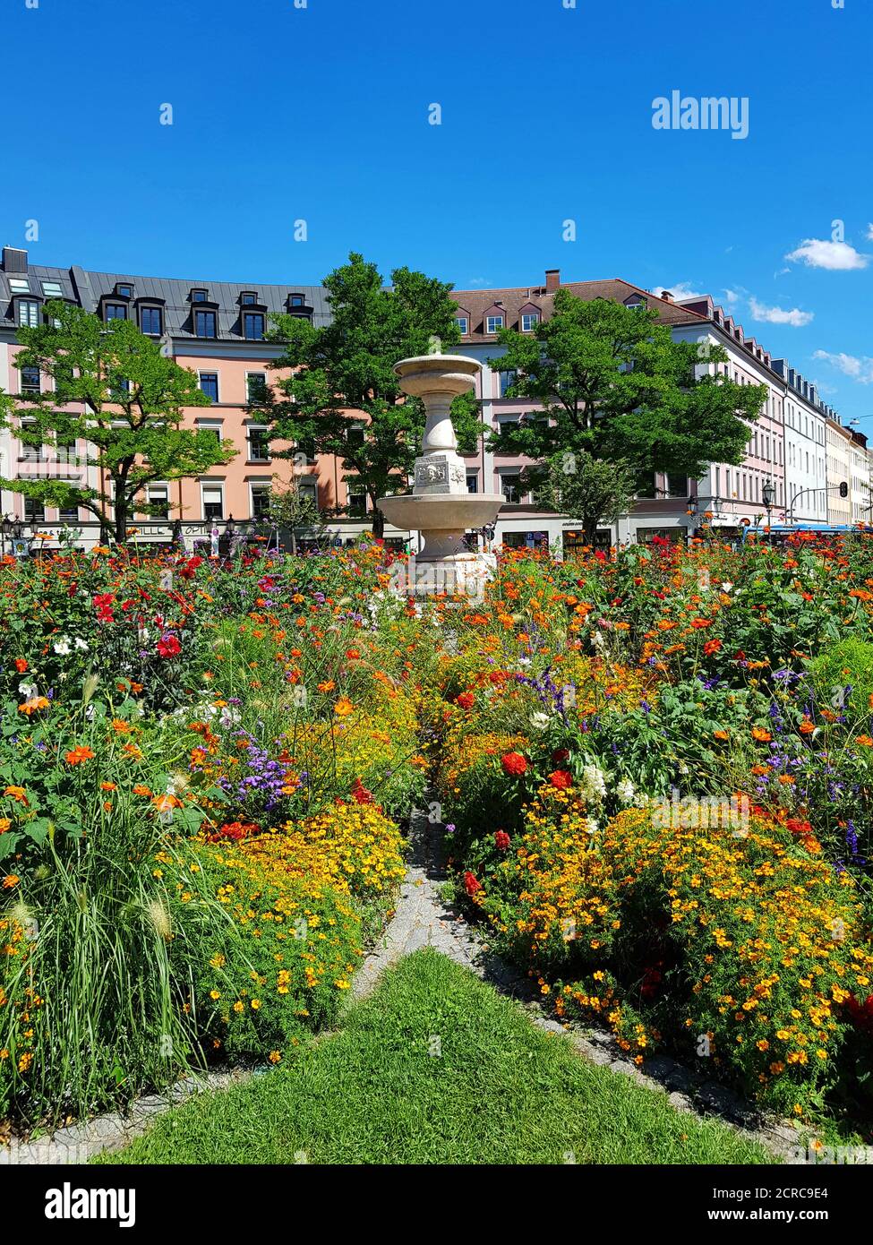 Munich, Gärtnerplatz, built in 1860 in honor of Friedich von Gärtner and designed by Max Kolb. Listed ensemble, Ludwigsvorstadt district, flower Stock Photo