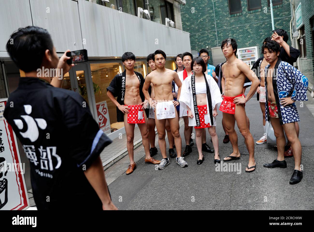 fundoshi or loin cloth pose for a photo prior to an event to pick trash on ...