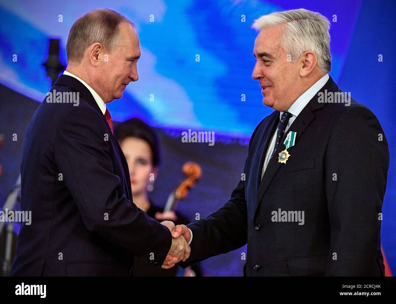 Russia's President Vladimir Putin decorates Spain's Rafael Guzman Tirado, Professor of Greek Philology and Slavic Philology of the University of Granada with the People's Friendship order during a reception on the National Unity Day at the Kremlin in Moscow, Russia November 4, 2017. REUTERS/Alexander Nemenov/Pool Stock Photo