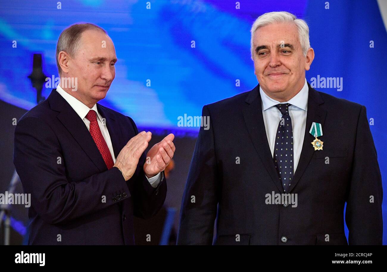Russia's President Vladimir Putin decorates Spanish Rafael Guzman Tirado, Professor of Greek Philology and Slavic Philology of the University of Granada with the People's Friendship order during a reception on the National Unity Day at the Kremlin in Moscow, Russia November 4, 2017. REUTERS/Alexander Nemenov/Pool Stock Photo