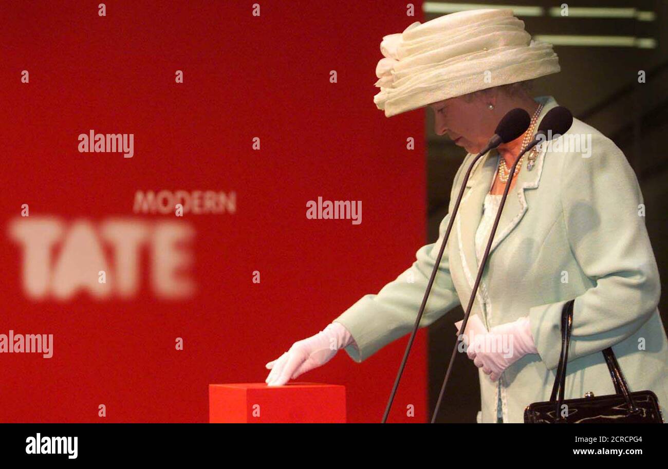 Britain's Queen Elizabeth pushes a button as she officially opens the Tate Modern Gallery in London May 11. The Queen opened London's newest art museum but heavy rain and a strong police presence meant a threatened protest by anarchists and anti-monarchists failed to materialise.  KD/PS/AS Stock Photo