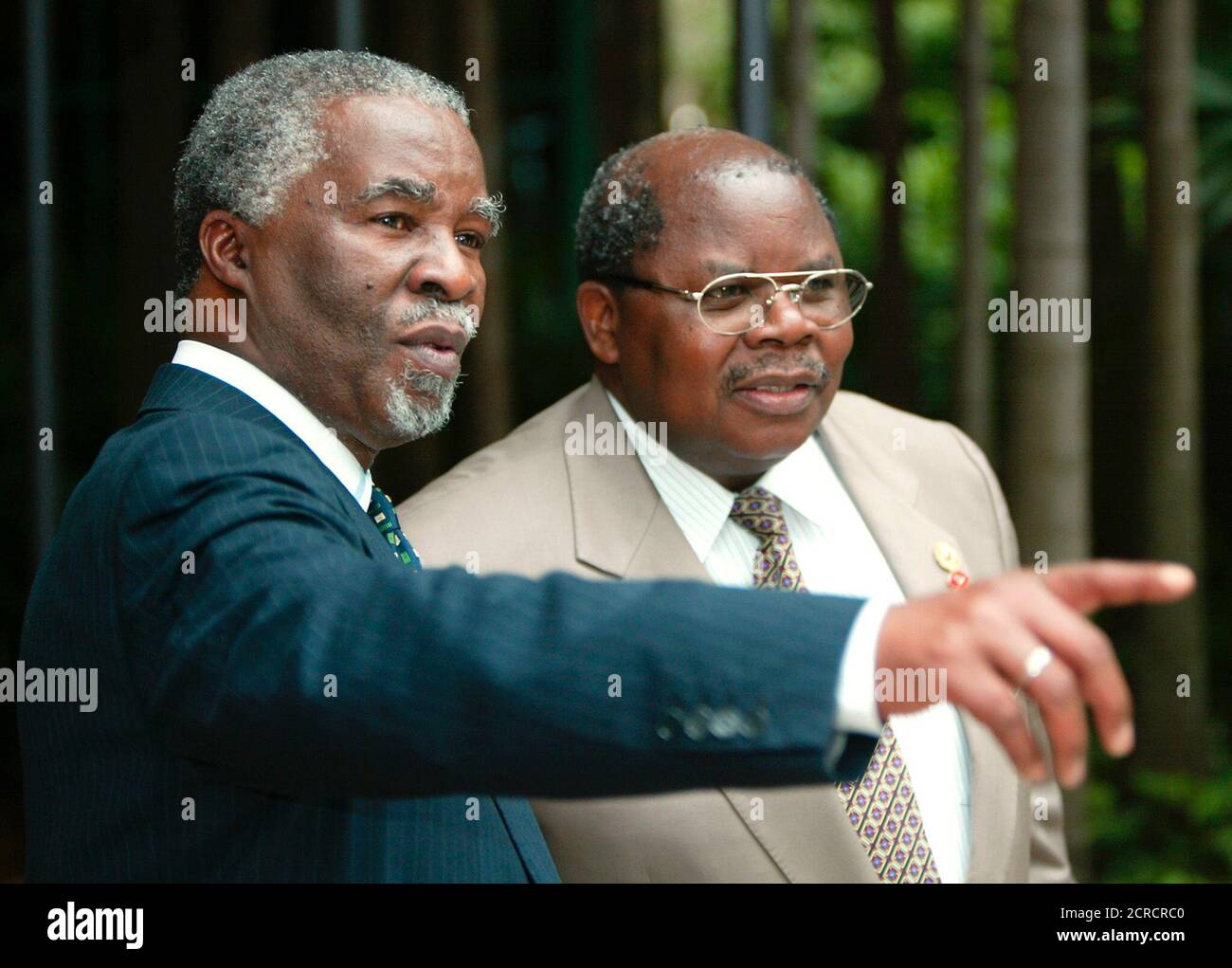 South Africa's President Thabo Mbeki gestures while talking to Tanzania's Benjamin Mkapa at the Commonwealth Heads of Government Meeting in Coolum March 3, 2002. Leaders from Commonwealth nations around the globe have gathered in Australia for the 35th biennial summit. REUTERS/Torsten Blackwood/Pool  MDB/JD Stock Photo