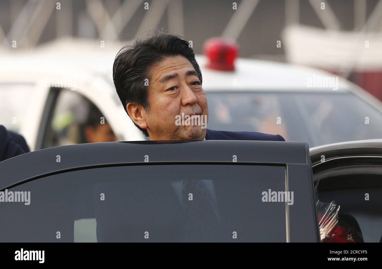 Japan's Prime Minister Shinzo Abe gets into a car after his arrival at the airport in New Delhi December 11, 2015. India and Japan are likely to finalize an agreement on protection of military information during Abe's trip beginning on Friday that will the lay the ground for Japanese arms sales to India, including seaplanes. REUTERS/Adnan Abidi Stock Photo