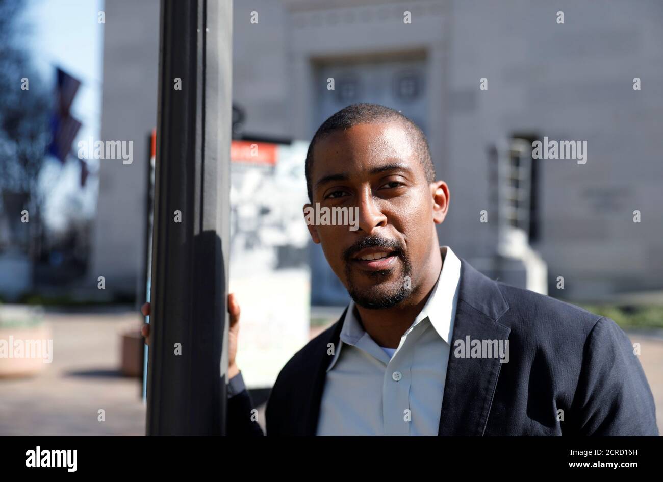 Johnathan Smith, formerly a staff attorney in the Civil Rights Division of the Obama Administration Justice Department, who is now the legal director of Muslim Advocates, stands in front of the U.S. Justice Department headquarters building where he used to work in Washington, U.S. March 9, 2017. Picture taken March 9, 2017. To match OBAMA-LAWYERS/ REUTERS/Jim Bourg Stock Photo