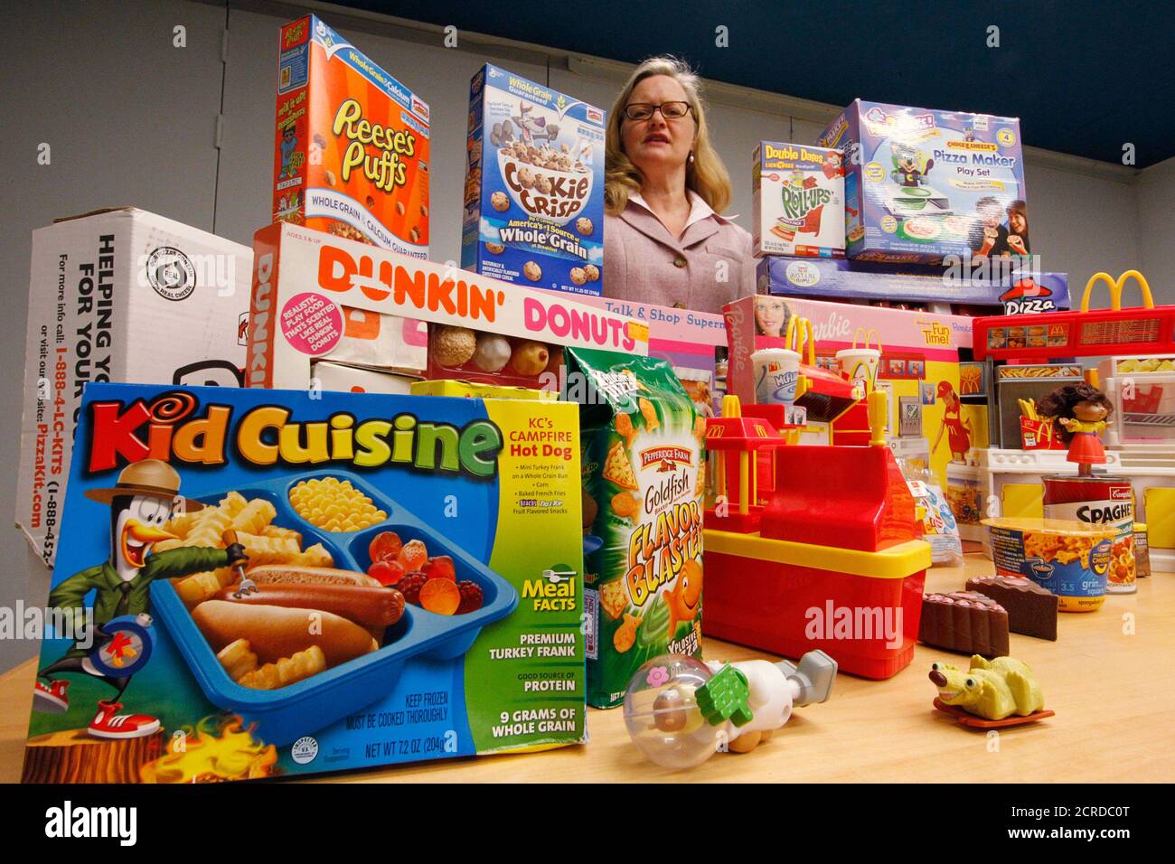 Margo G. Wootan, Director of Nutrition Policy for the Center for Science in the Public Interest displays foods, toys and giveaways marketed by the food industry towards young children in Washington, April 24, 2012.  Picture taken April 24, 2012. To match Special Report USA-FOODLOBBY/  REUTERS/Jim Bourg    (UNITED STATES - Tags: POLITICS HEALTH FOOD BUSINESS) Stock Photo