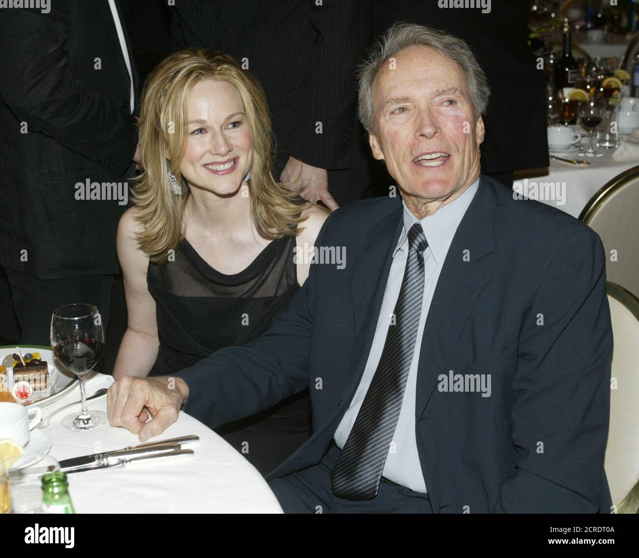 Director Clint Eastwood and actress Laura Linney converse after the 9th  annual Critics Choice Awards sponsored by the Broadcast Film Critics  Association January 10, 2004 in Beverly Hills. Eastwood directed the film "