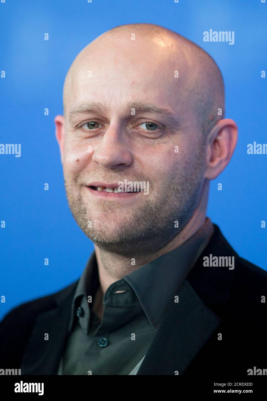 Cast member Juergen Vogel poses for pictures during a photocall to promote the movie 'Mercy' (Gnade) at Berlinale International Film Festival in Berlin February 16, 2012. REUTERS/Thomas Peter (GERMANY - Tags: ENTERTAINMENT HEADSHOT) Stock Photo