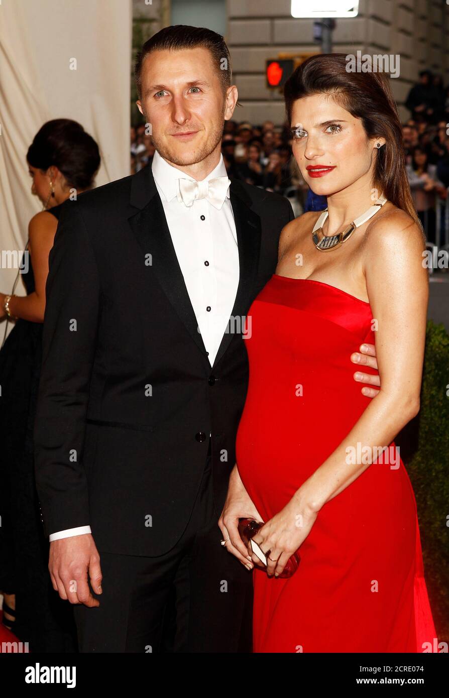 Scott Campbell and Lake Bell arrive at the Metropolitan Museum of Art Costume Institute Gala Benefit celebrating the opening of 'Charles James: Beyond Fashion' in Upper Manhattan, New York May 5, 2014.  REUTERS/Carlo Allegri (UNITED STATES  - Tags: ENTERTAINMENT FASHION) Stock Photo