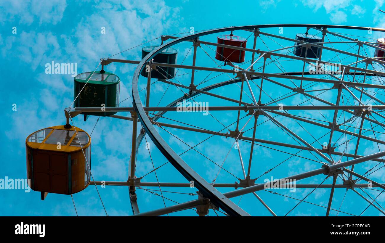 colorful ferris wheel with blue sky background Stock Photo - Alamy