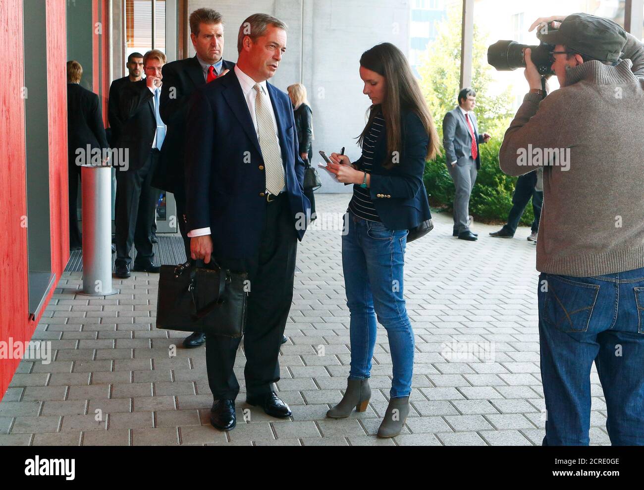 Nigel Farage, leader of the United Kingdom Independence Party (UKIP),  talks to a journalist before he takes part at an extra-ordinary meeting of the Action for an Independent and Neutral Switzerland AUNS in the northern Swiss town of Winterthur October 4, 2014.  REUTERS/Arnd Wiegmann (SWITZERLAND - Tags: POLITICS) Stock Photo
