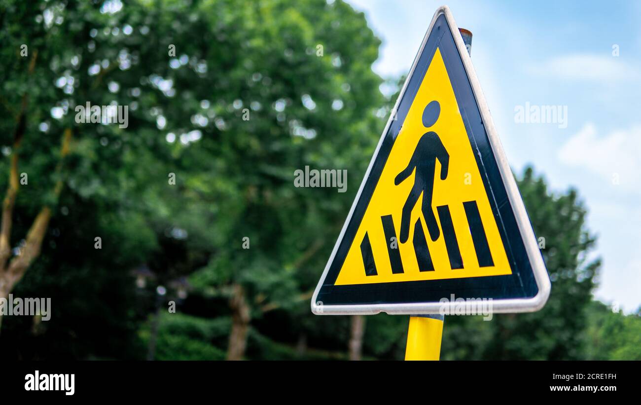 a sign post of students crossing Stock Photo