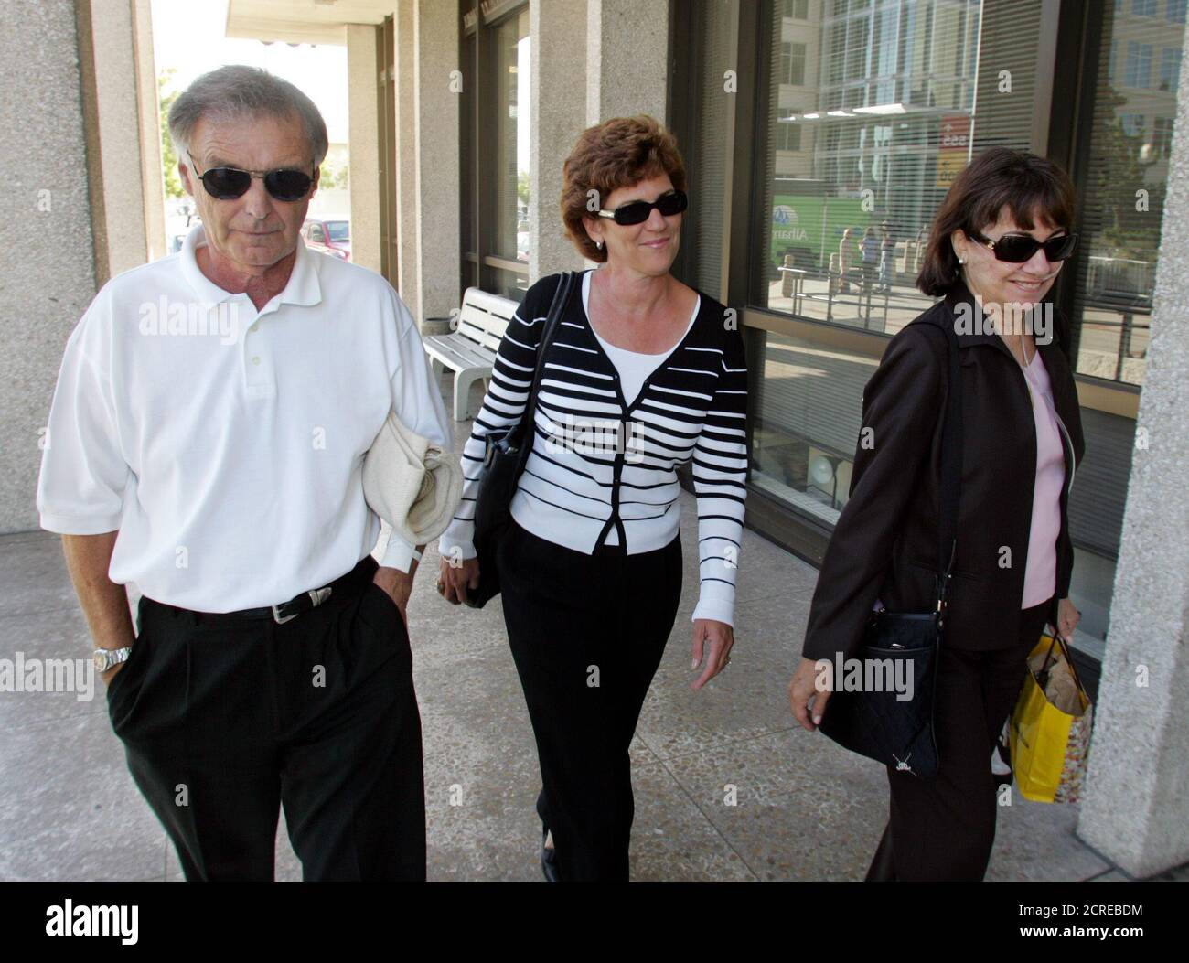 Lee Peterson (L), father, Susan Caudillo (C), sister, and Jackie Peterson, mother, of accused double murderer Scott Peterson arrive for his trial at the San Mateo County Superior Courthouse in Redwood City, California, September 7, 2004. Scott Peterson is charged with the murders of his wife Laci and the couple's unborn son Connor. REUTERS/Lou Dematteis/Pool REUTERS  LD Stock Photo