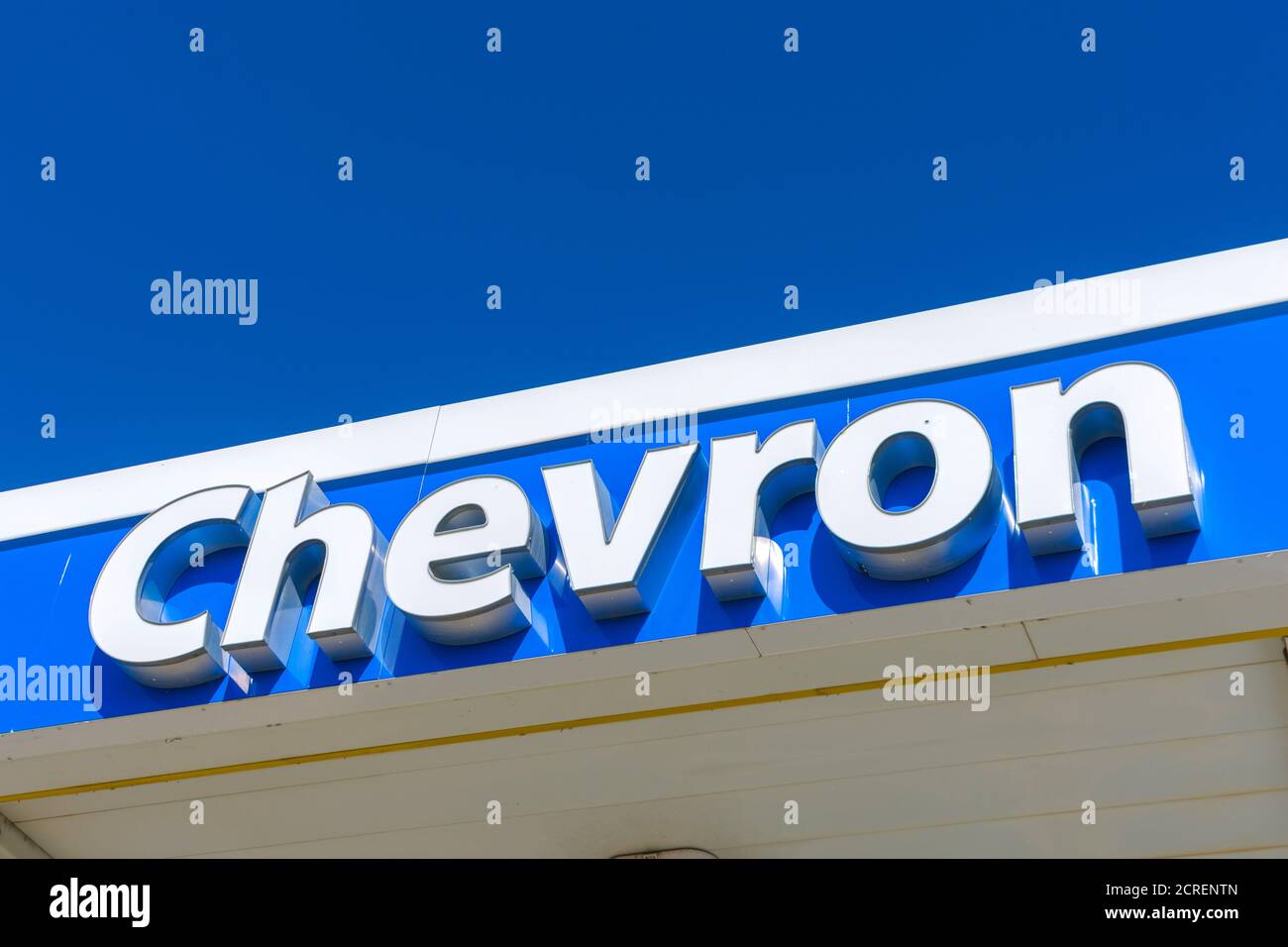 Chevron oil industry company sign on a roof of a Chevron gas station