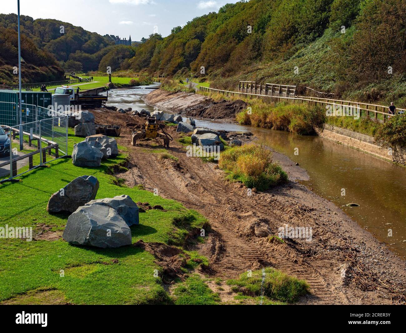 Civil Engineering works at the Saltburn river mouth with reinforcing rock armour being installed Stock Photo