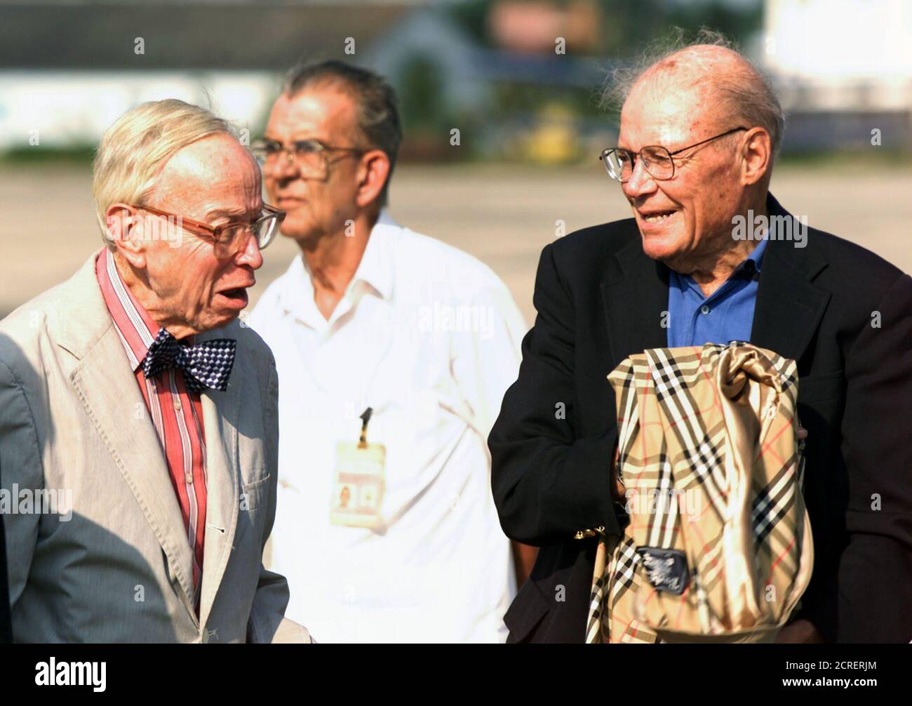 Former Secretary of Defense Robert McNamara (R) and special aide to the President Arthur Schlesinger arrive in Havana, October 10, 2002. McNamara and Schlesinger, who both worked during the John F. Kennedy administration, are part of a U.S. delegation participating in a gathering to talk about the 1962 Cuban missile crisis. REUTERS/Rafael Perez RP Stock Photo