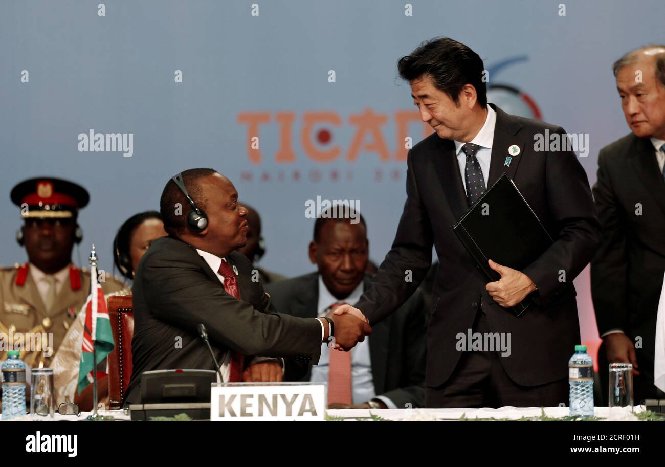Japan's Prime Minister Shinzo Abe (R) greets Kenya's President Uhuru Kenyatta as they attend Sixth Tokyo International Conference on African Development (TICAD VI) in Kenya's capital Nairobi, August 27, 2016. REUTERS/Thomas Mukoya Stock Photo