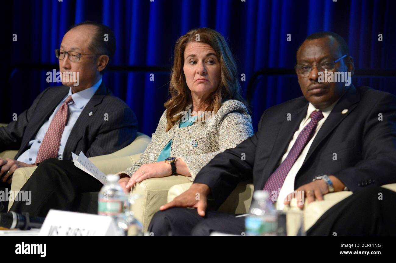 Co-Chair of the Bill & Melinda Gates Foundation Melinda Gates (C) listens  along with World Bank Group President Jim Yong Kim (L) and Rwanda's Finance  Minister Claver Gatete during a panel discussion