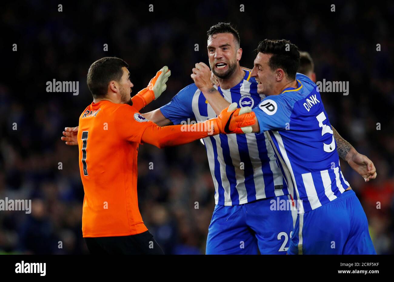 Soccer Football - Premier League - Brighton & Hove Albion v Manchester United - The American Express Community Stadium, Brighton, Britain - May 4, 2018 Brighton's Shane Duffy celebrates after the match with Lewis Dunk and Mathew Ryan REUTERS/Eddie Keogh EDITORIAL USE ONLY. No use with unauthorized audio, video, data, fixture lists, club/league logos or "live" services. Online in-match use limited to 75 images, no video emulation. No use in betting, games or single club/league/player publications. Please contact your account representative for further details. Stock Photo
