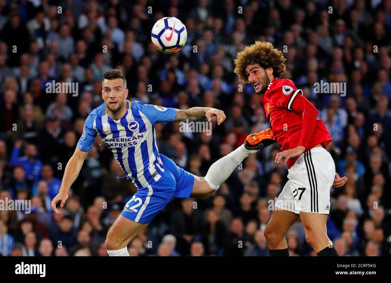 Soccer Football - Premier League - Brighton & Hove Albion v Manchester United - The American Express Community Stadium, Brighton, Britain - May 4, 2018   Manchester United's Marouane Fellaini in action with Brighton's Shane Duffy   REUTERS/Eddie Keogh    EDITORIAL USE ONLY. No use with unauthorized audio, video, data, fixture lists, club/league logos or "live" services. Online in-match use limited to 75 images, no video emulation. No use in betting, games or single club/league/player publications.  Please contact your account representative for further details. Stock Photo