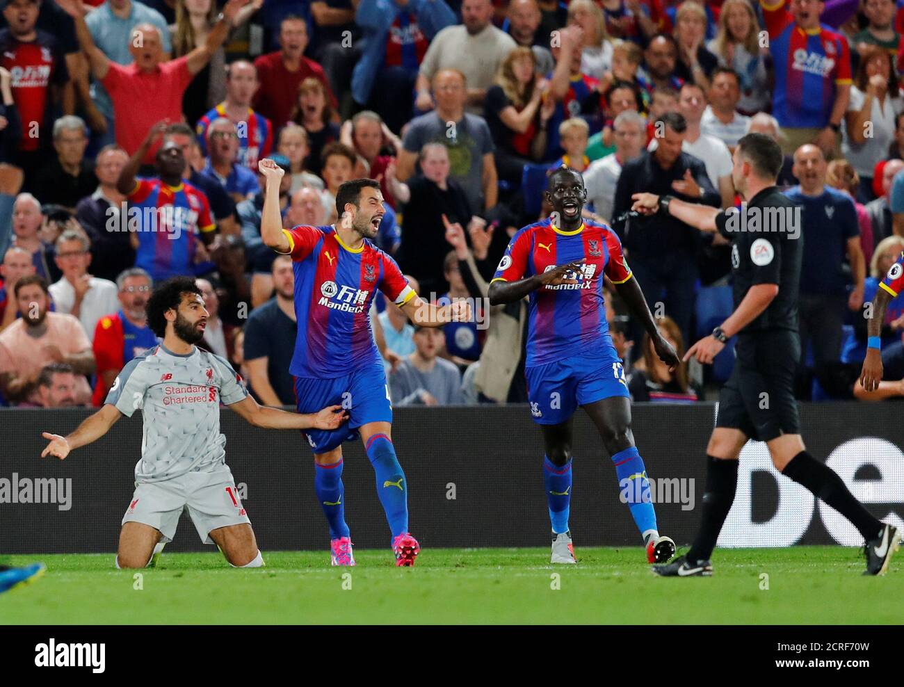 Soccer Football - Premier League - Crystal Palace v Liverpool - Selhurst Park, London, Britain - August 20, 2018 Crystal Palace's Mamadou Sakho concedes a penalty against Liverpool's Mohamed Salah REUTERS/Eddie Keogh EDITORIAL USE ONLY. No use with unauthorized audio, video, data, fixture lists, club/league logos or "live" services. Online in-match use limited to 75 images, no video emulation. No use in betting, games or single club/league/player publications. Please contact your account representative for further details. Stock Photo