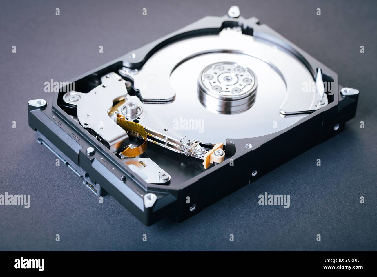 disassembled computer hard drive on black background Stock Photo