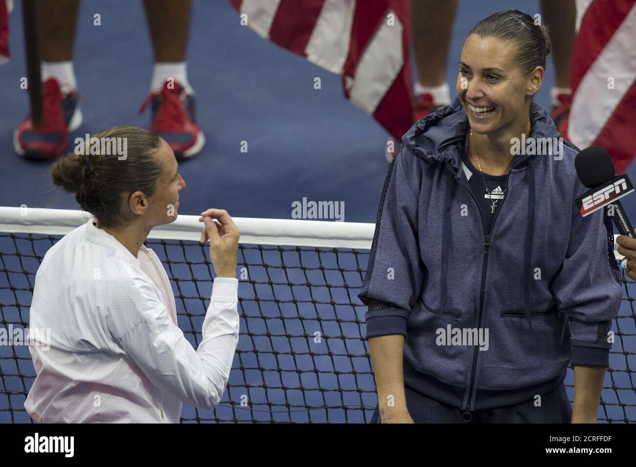 Roberta Vinci (L) of Italy gestures to compatriot Flavia Pennetta after the latter said she was going to retire from professional tennis after winning the women's singles final match at the U.S. Open Championships tennis tournament in New York, September 12, 2015. REUTERS/Carlo Allegri Stock Photo