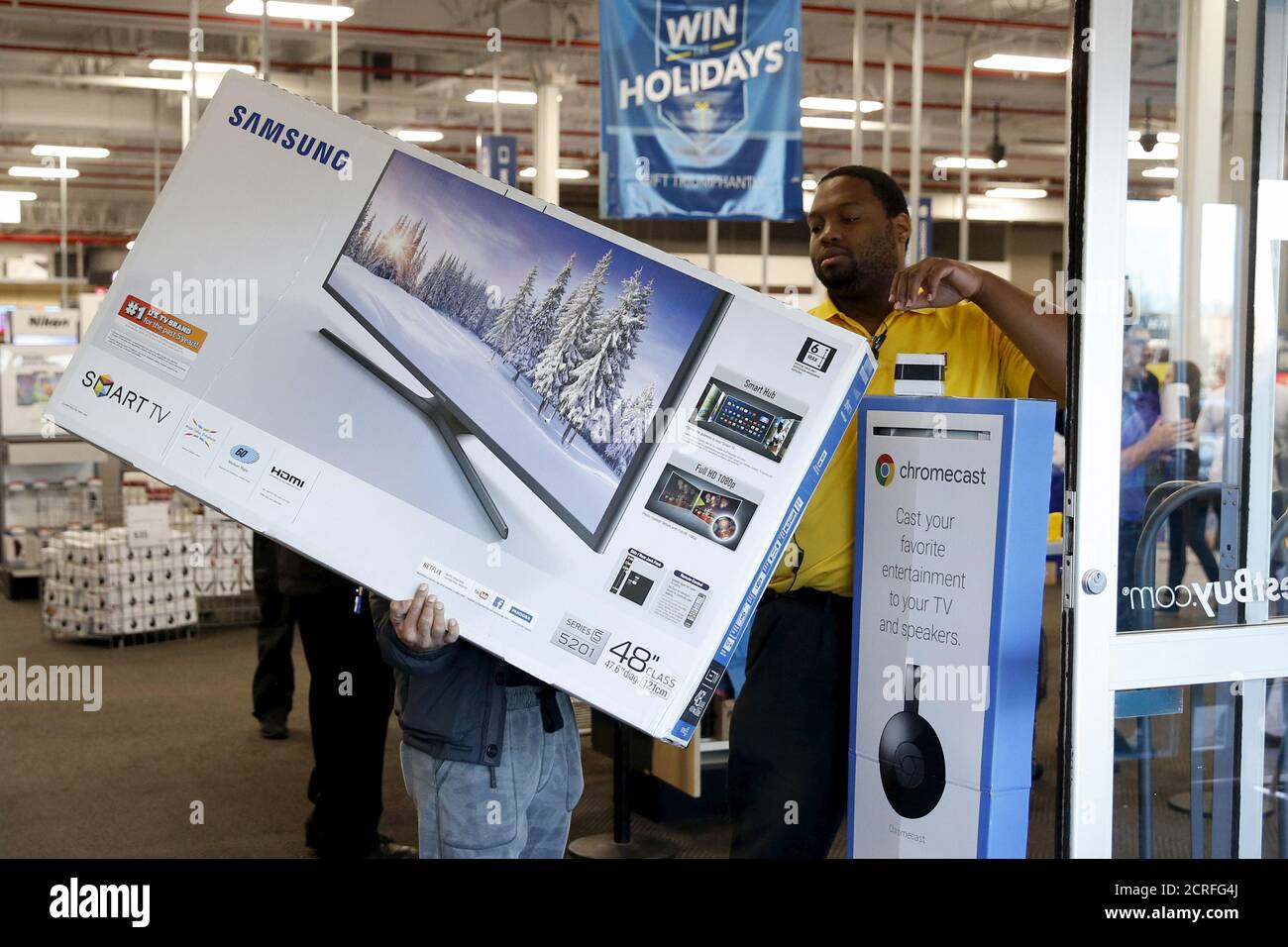 A shopper has receipt checked for a Samsung television before leaving a  Best Buy store in Westbury, New York November 27, 2015. Crowds were thin at U.S. stores and shopping malls in the early hours of Friday, initial spot checks showed, as shoppers responded to early Black Friday discounts with a mix of enthusiasm and caution. REUTERS/Shannon Stapleton Stock Photo