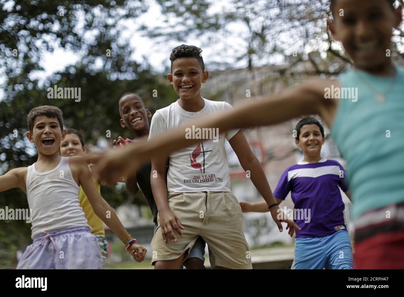 Children react after a soccer match in Alamar, on the outskirts of Havana, Cuba March 19, 2016. REUTERS/Ueslei Marcelino Stock Photo