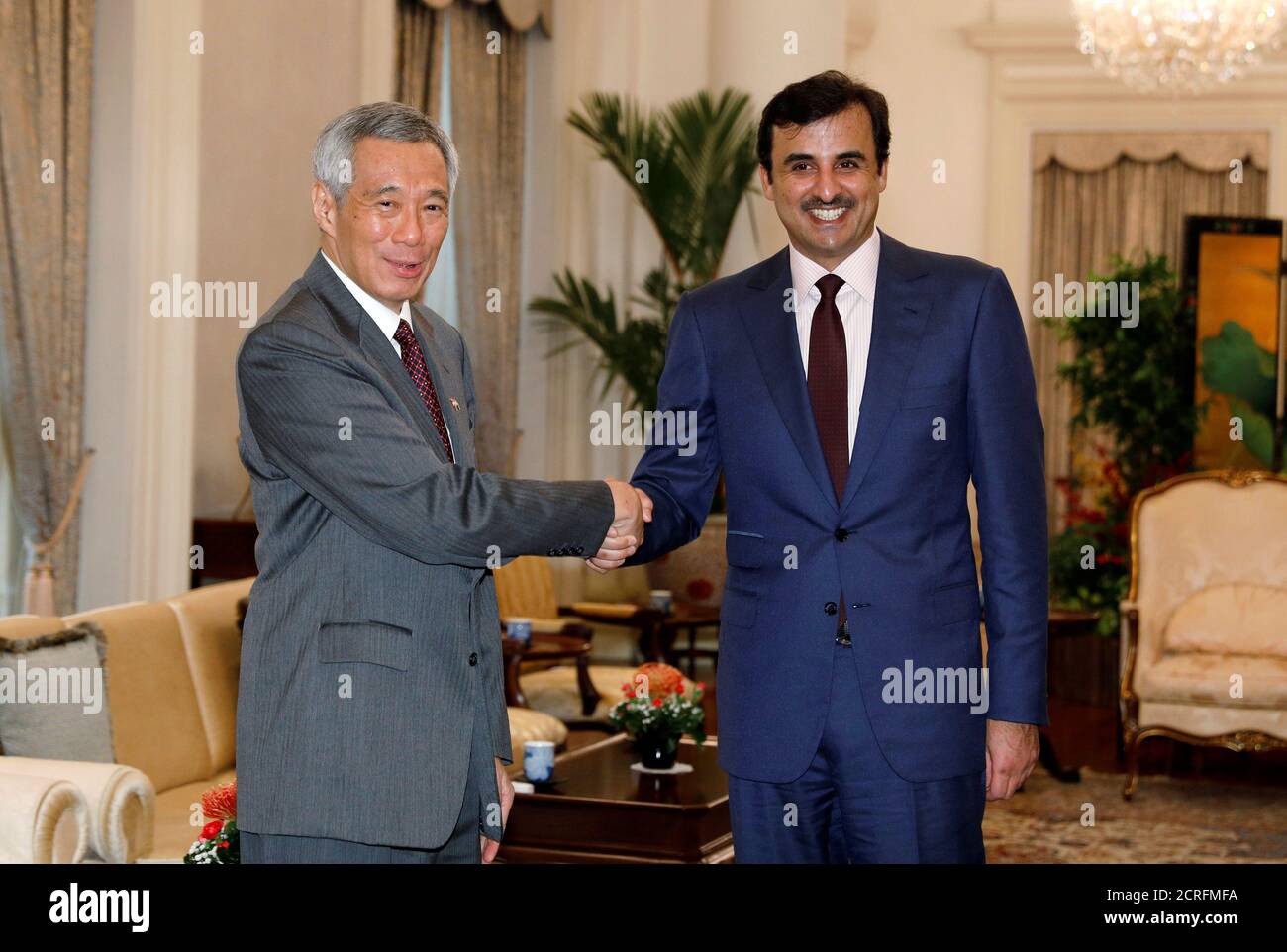 Qatar's Emir Sheikh Tamim bin Hamad al-Thani meets with Singapore's Prime Minister Lee Hsien Loong at the Istana in Singapore October 17, 2017. REUTERS/Edgar Su Stock Photo
