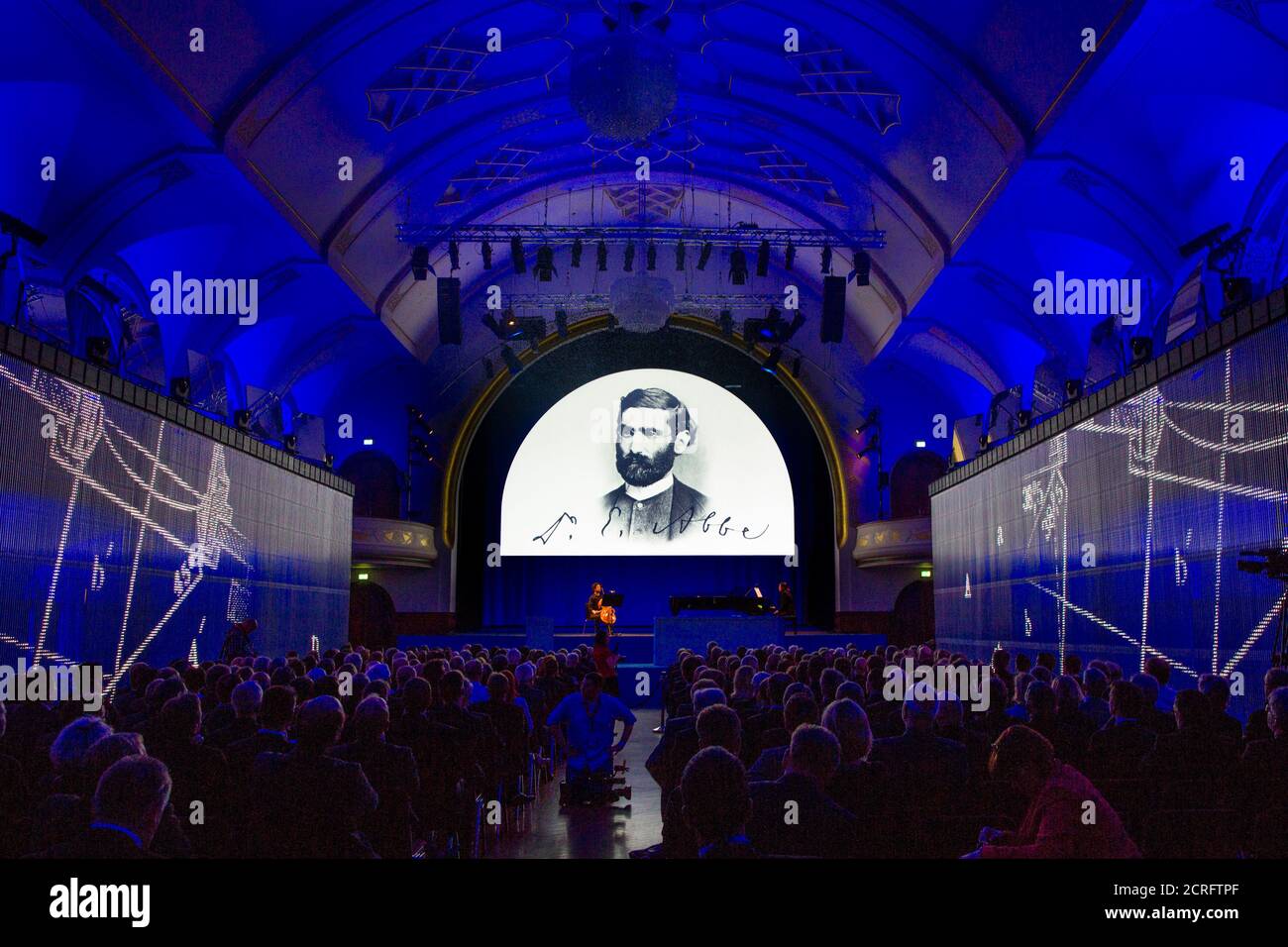 A projection shows the portrait of German optical scientist and initiator of the Carl Zeiss foundation Ernst Abbe during a ceremony marking the 125th anniversary of the foundation in Jena, May 19, 2014. REUTERS/Thomas Peter (GERMANY - Tags: POLITICS SCIENCE TECHNOLOGY BUSINESS) Stock Photo