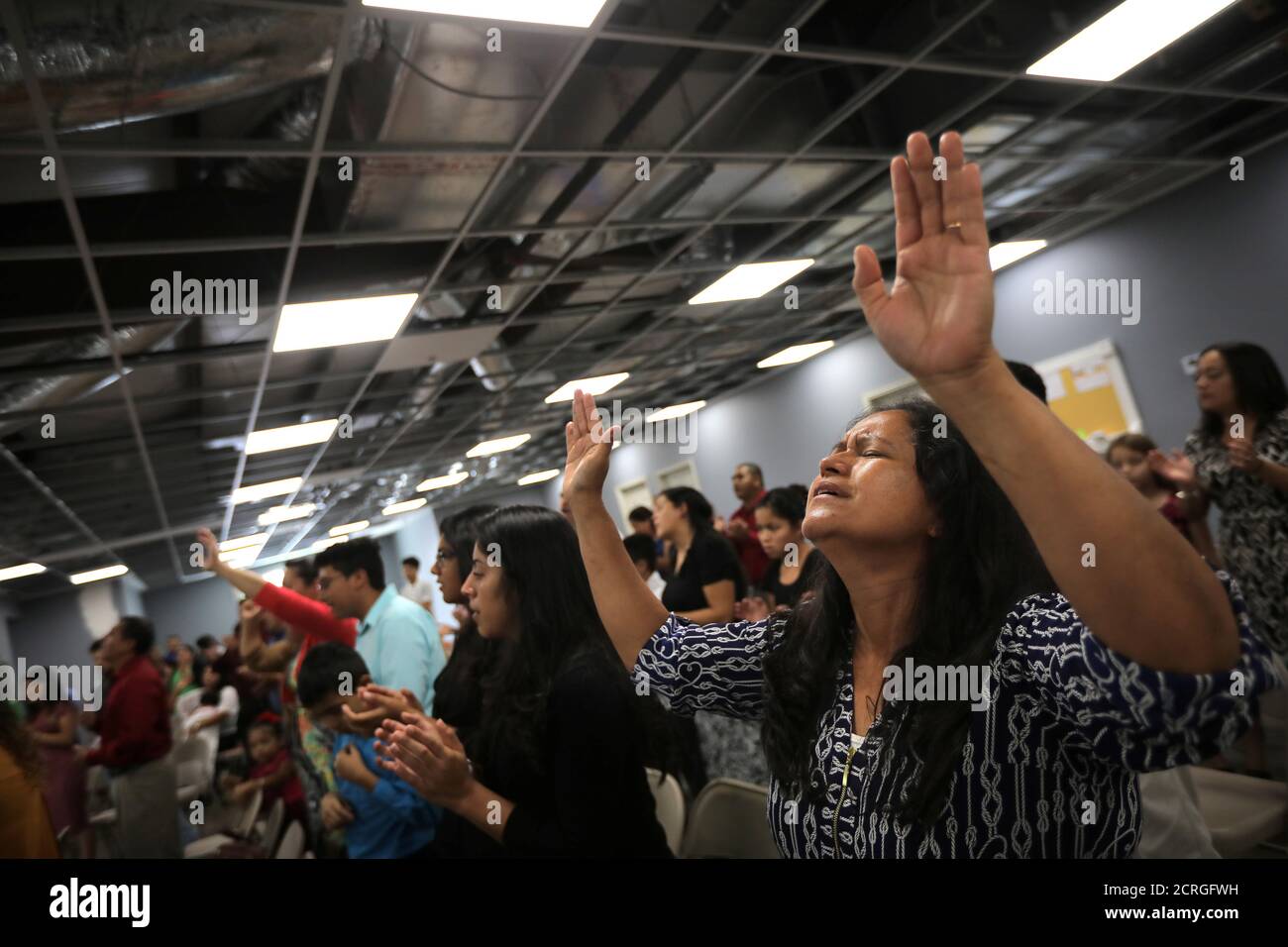 Local residents take part in the first church service after Tropical Storm  Harvey at the Iglesia de Dios Pentecostal . El Triunfo church in east  Houston, Texas, ., September 3, 2017. REUTERS/Carlos