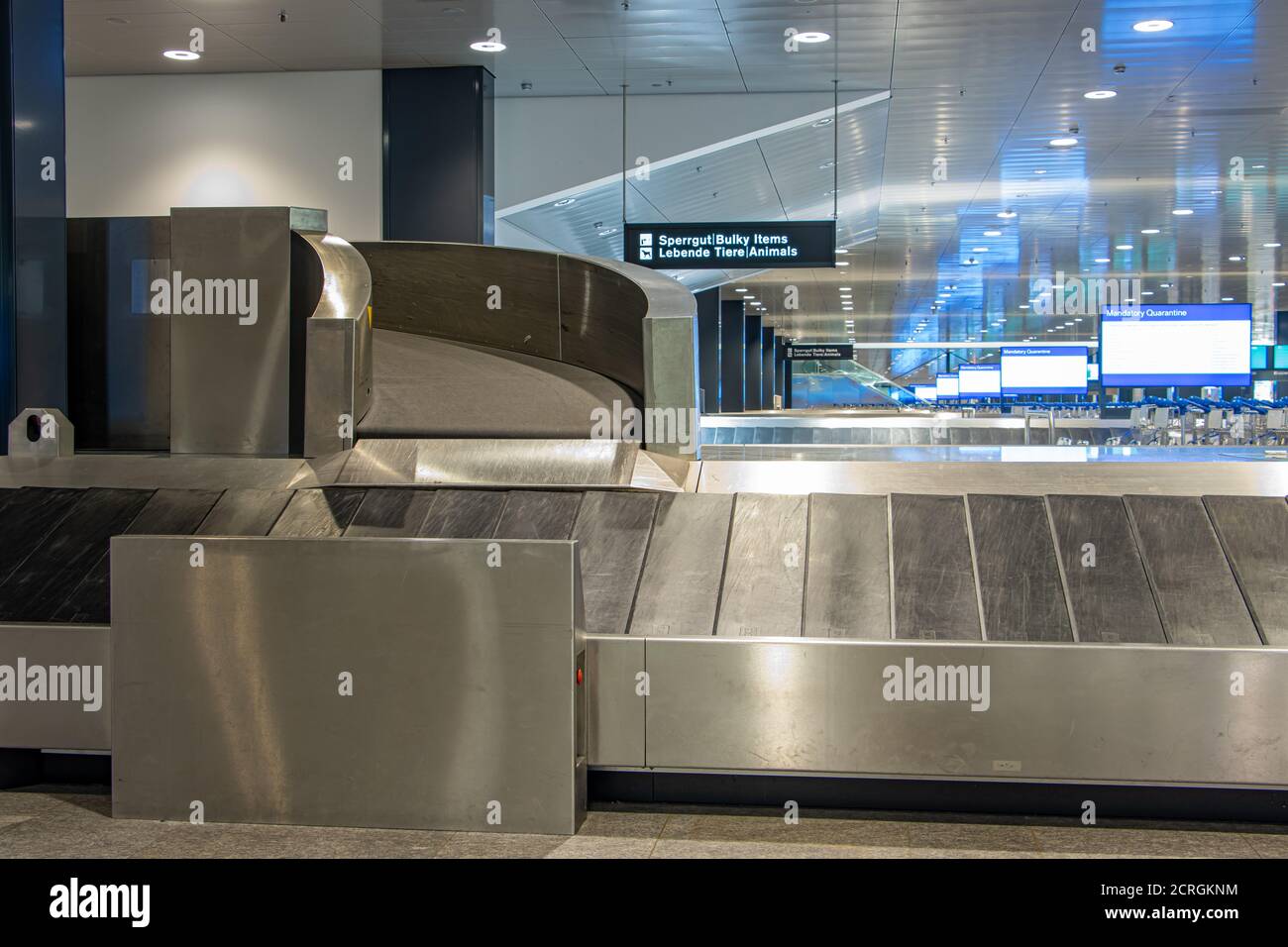 Empty conveyor belt for luggage at the airport. Terminal of airport without people. Stock Photo