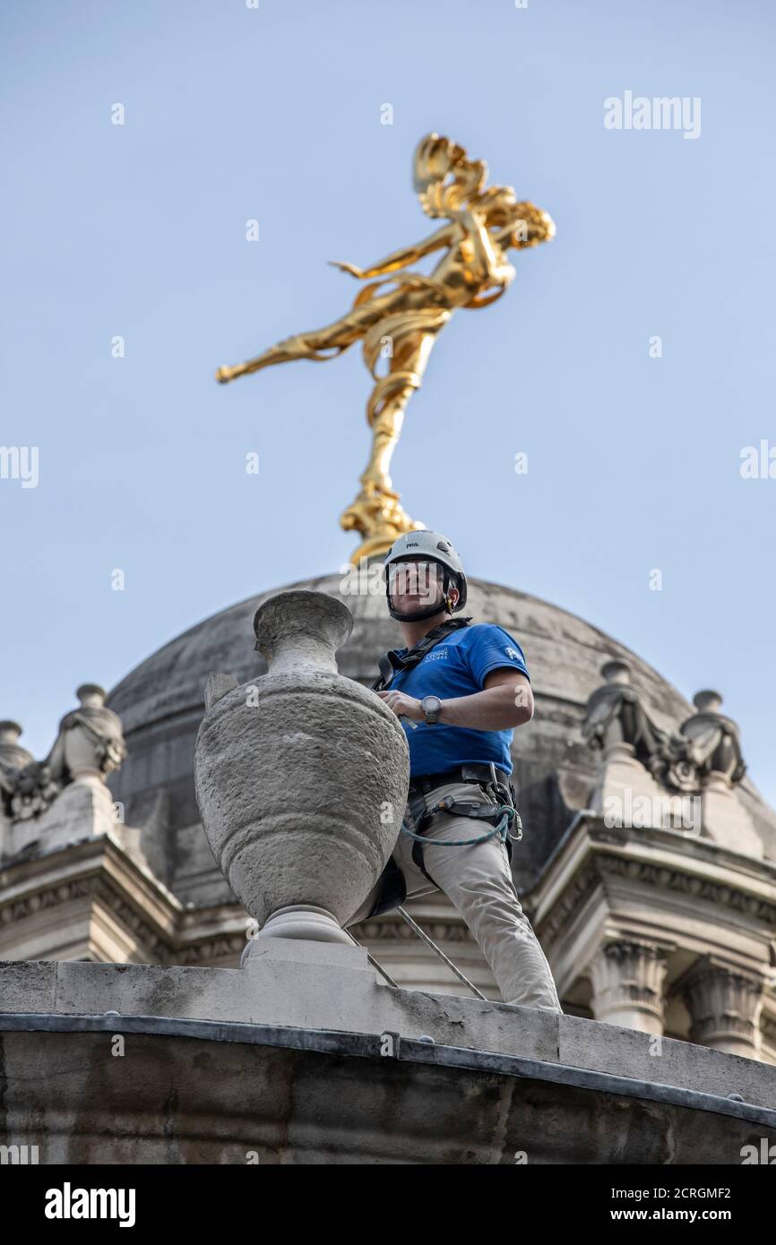 London, UK. 19th September, 2020. Stone Mason Richard Martin carries out restoration work at the weekend on the Bank of England stone heritage sculptures under the gold Statue of Ariel adorning the dome on Tivoli Corner, City Of London, United Kingdom Threadneedle Street, City of London, 19th September 2020 Credit: Jeff Gilbert/Alamy Live News Stock Photo