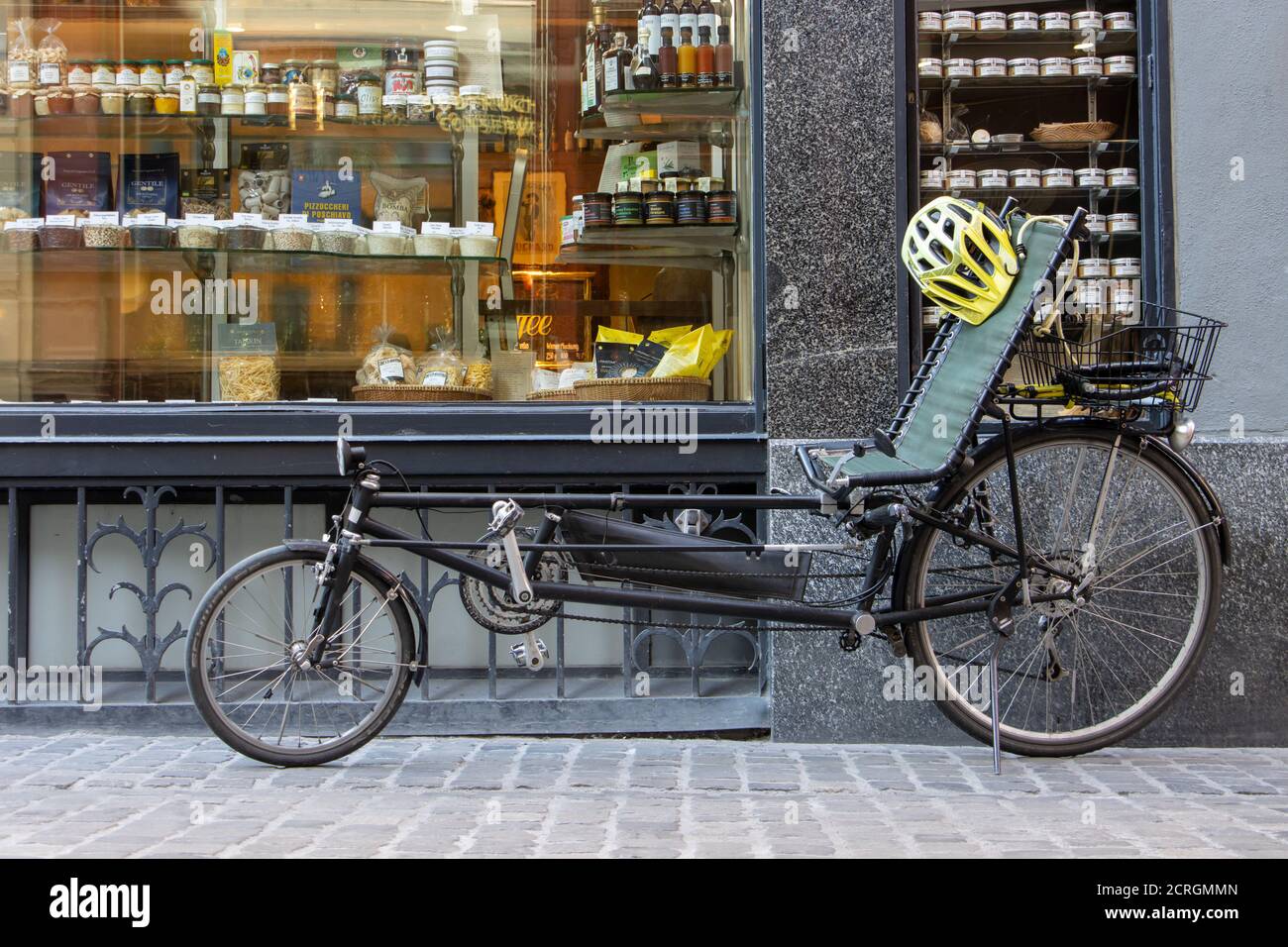 ZURICH, SWITZERLAND, JUL 30 2020, A Recumbent Bikes -  Lay Bicycle, parked before shop with food. Stock Photo
