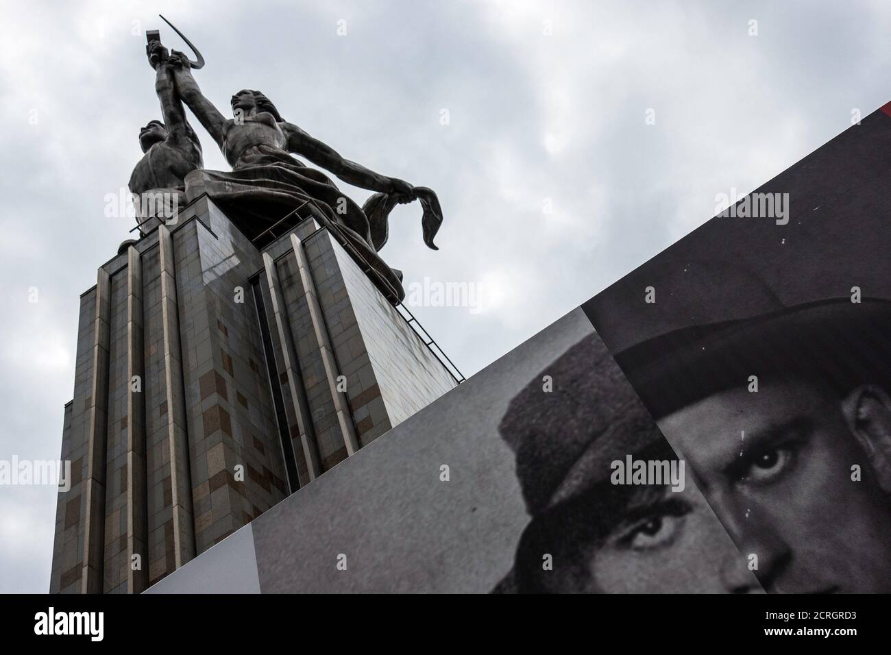 A picture of the Soviet poet Vladimir Mayakovsky is seen under the monument and sculpture of 'Worker and Kolkhoz Woman' in Moscow, Russia, July 10, 2018.  REUTERS/Damir Sagolj Stock Photo