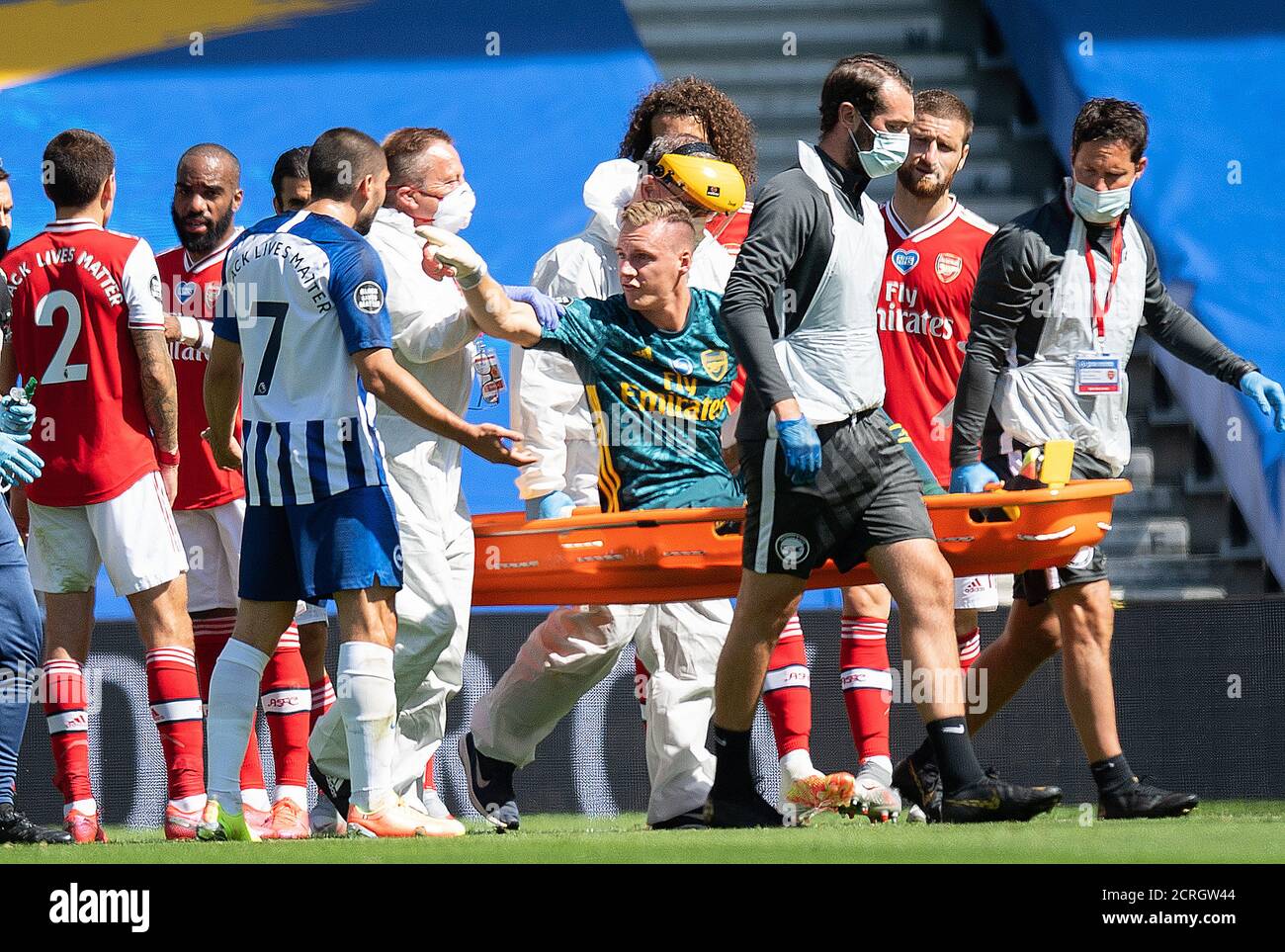 Bernd Leno is stretchered off during the Premier League match at the AMEX Stadium, Brighton and remonstrates with Neil Maupay who he collided with to Stock Photo