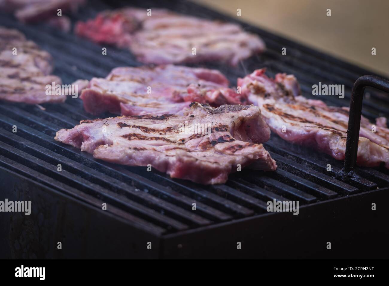 Roasting meat with beer in nature, barbecue concept Stock Photo Alamy