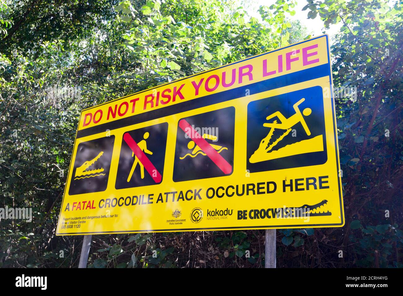 Warning safety sign against crocodiles in the East Alligator River, Kakadu National Park, Northern Territory, NT, Australia Stock Photo