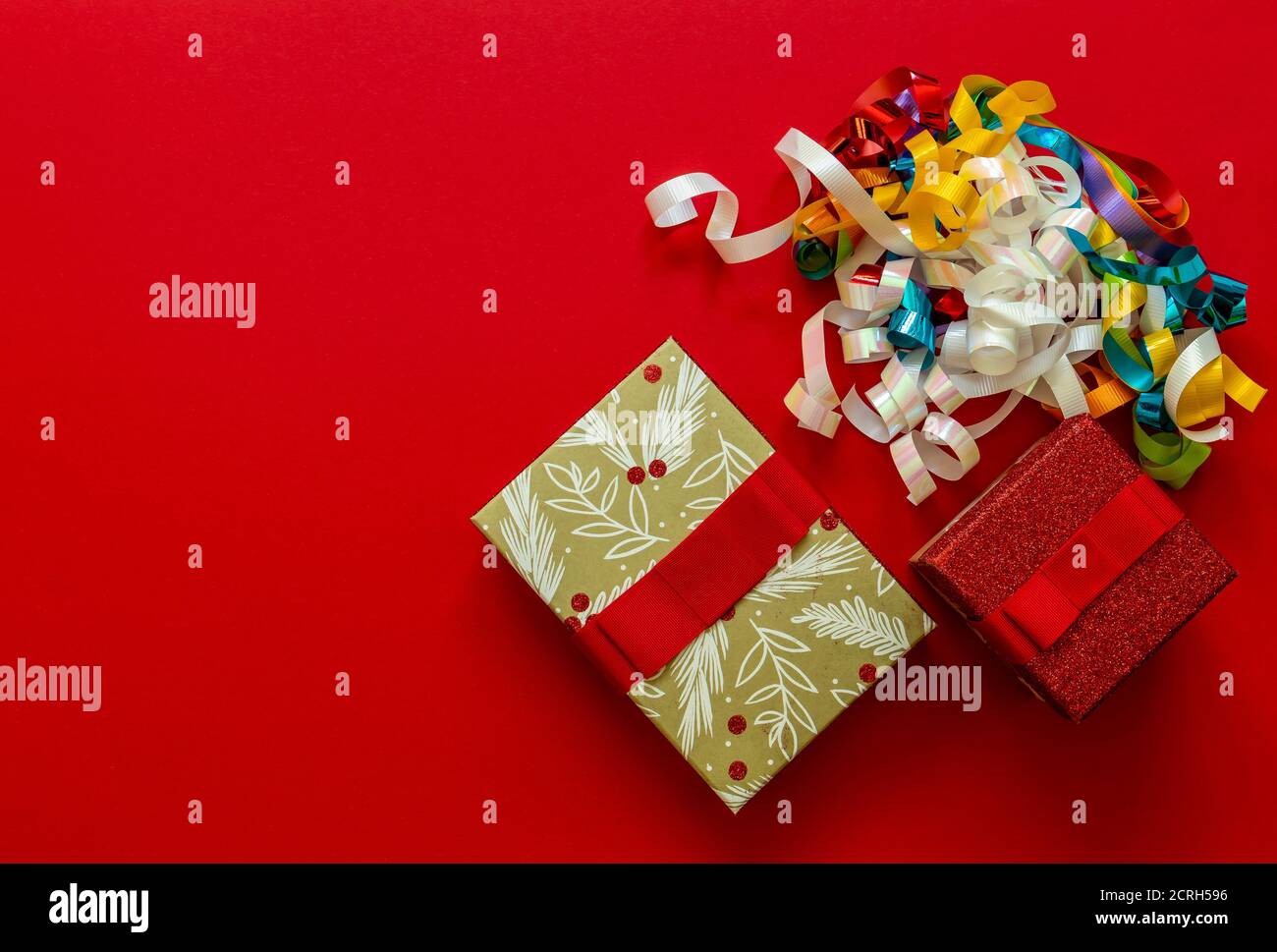 Christmas background with gift boxes and decorations on red.  Stock Photo