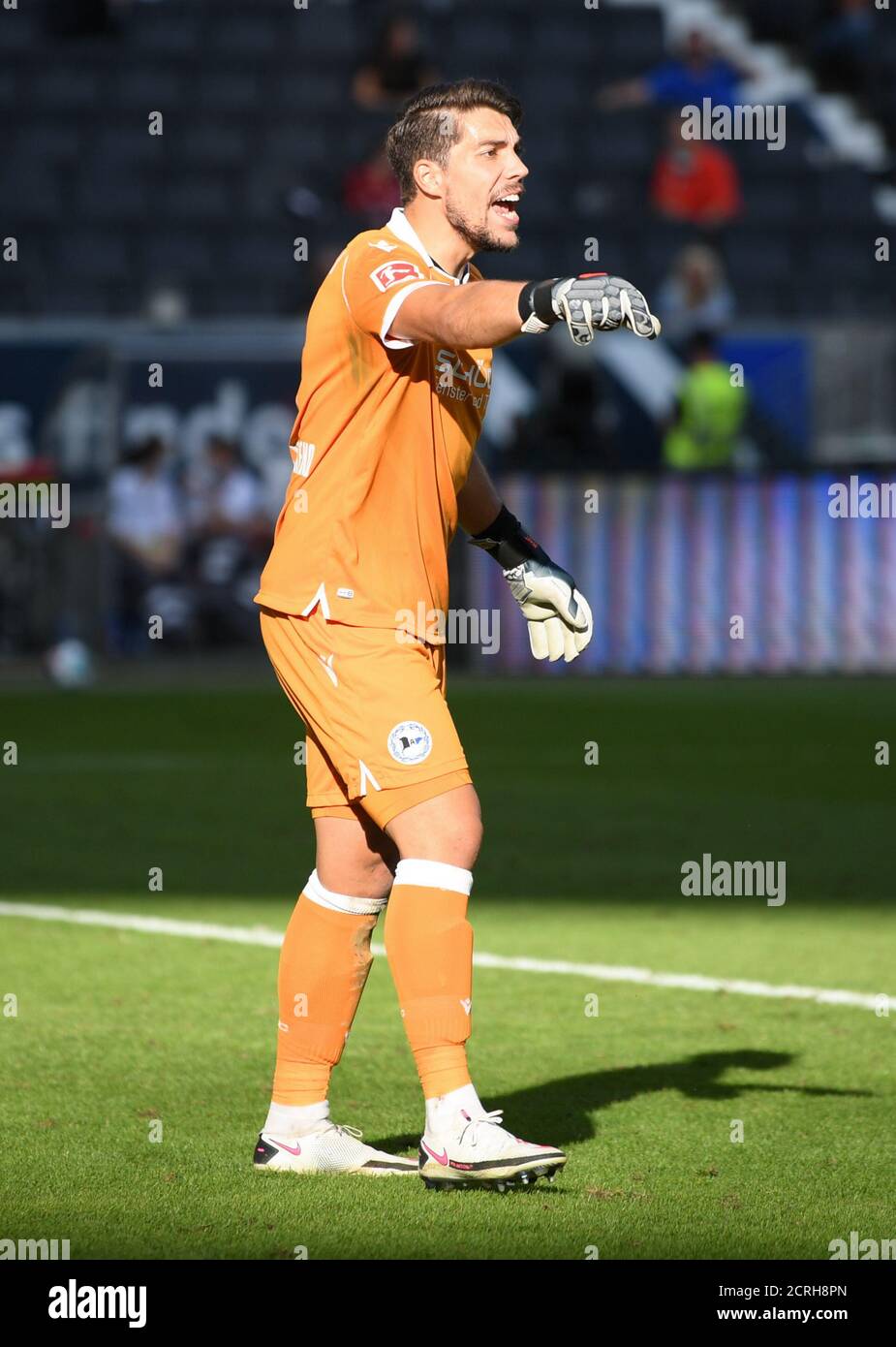 Munich's goalkeeper Stefan Ortega Moreno (R) catches the penalty shot by  Andreas Geipl of Regensburg (2-R) during the 2. Bundesliga relegation match  between Jahn Regensburg and TSV 1860 Munich at the Continental